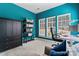 Bright office space with a large window, desk, and ample storage shelves at 204 Silvercliff Dr, Mount Holly, NC 28120