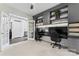 Home office with custom built-in cabinets and a view of the staircase at 204 Silvercliff Dr, Mount Holly, NC 28120