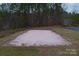 Aerial view of a sand volleyball court surrounded by greenery at 204 Silvercliff Dr, Mount Holly, NC 28120