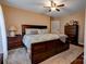 Spacious main bedroom featuring a ceiling fan, ensuite bath and ample storage space at 210 Keltic Meadows Dr, Gastonia, NC 28056