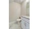 Clean half-bathroom with white vanity, neutral walls, and tile floors offering a simple functional design at 2123 Isom St, Charlotte, NC 28208