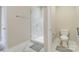 Bathroom featuring a glass shower, toilet, and modern fixtures at 2123 Isom St, Charlotte, NC 28208