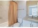 Well-lit bathroom featuring a shower with marble tile, a vanity sink, and modern fixtures at 2123 Isom St, Charlotte, NC 28208