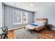 Cozy bedroom featuring a bed, stylish bench, and ample natural light from the window at 2123 Isom St, Charlotte, NC 28208
