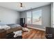 Bright bedroom with hardwood flooring and large windows that offer plenty of natural light at 2123 Isom St, Charlotte, NC 28208