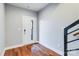 Bright entryway features hardwood floors, neutral walls, and a modern front door at 2123 Isom St, Charlotte, NC 28208