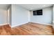 Empty living room featuring hardwood floors and white trim at 2123 Isom St, Charlotte, NC 28208