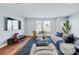 Bright and airy living room showcasing stylish furnishings and plenty of natural light at 2123 Isom St, Charlotte, NC 28208