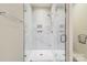 Close up view of a tile shower featuring a rainfall shower head and a shower caddy at 2123 Isom St, Charlotte, NC 28208