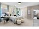 Inviting bedroom featuring a large window, plush bedding, and double closets at 2208 Indigo Branch Rd, Indian Land, SC 29707