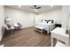 Spacious bedroom features hardwood floors, ceiling fan, and furniture at 226 Malvern Sw Dr, Concord, NC 28025