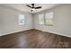 Bright bedroom features hardwood floors, ceiling fan, and lots of natural light at 226 Malvern Sw Dr, Concord, NC 28025