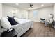 Spacious bedroom with hardwood floors, ceiling fan, and plenty of light at 226 Malvern Sw Dr, Concord, NC 28025