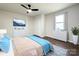 Bedroom virtually staged with hardwood floors, ceiling fan, and window at 226 Malvern Sw Dr, Concord, NC 28025