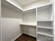 Bright closet featuring clean white shelving and sleek wood-look flooring at 226 Malvern Sw Dr, Concord, NC 28025