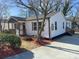 Well-maintained home with white siding, front porch, landscaped yard, and convenient driveway at 226 Malvern Sw Dr, Concord, NC 28025