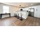 Bright kitchen with stainless steel appliances, white cabinets, and breakfast bar seating at 226 Malvern Sw Dr, Concord, NC 28025