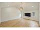 Spacious bedroom with high ceilings, hardwood floors, and a flat-screen TV at 229 N Canterbury Rd, Charlotte, NC 28211