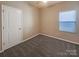 Cozy bedroom features neutral carpet, ceiling fan, and ample natural light from the window at 23186 Goose Down Ln, Lancaster, SC 29720