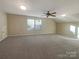 Vast upstairs bonus room with neutral carpeting and a ceiling fan at 23186 Goose Down Ln, Lancaster, SC 29720