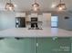 Contemporary kitchen featuring a large island with pendant lighting and modern black appliances at 23186 Goose Down Ln, Lancaster, SC 29720