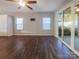 Spacious living room with wood floors, a ceiling fan, and sliding glass doors to the outside at 23186 Goose Down Ln, Lancaster, SC 29720