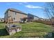 Spacious backyard features a firepit, seating, pergola, playset, and ample green space at 2352 Seagull Dr, Denver, NC 28037