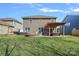 The backyard offers a firepit, seating, pergola, playset, and expansive lawn at 2352 Seagull Dr, Denver, NC 28037