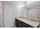 This bathroom features a double sink with a granite countertop and custom cabinetry at 2352 Seagull Dr, Denver, NC 28037