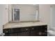 This bathroom features double sinks with granite countertops and sleek cabinetry at 2352 Seagull Dr, Denver, NC 28037