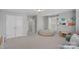 Large bonus room with plenty of natural light, cozy seating, and tons of room for activities at 2352 Seagull Dr, Denver, NC 28037