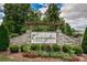Stone sign at the community entrance with a manicured garden in the foreground at 2352 Seagull Dr, Denver, NC 28037