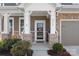 Inviting front porch with stone pillars and a 'welcome' sign, leading to the entrance of the house at 2352 Seagull Dr, Denver, NC 28037
