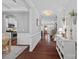 Bright hallway with dark wood floors and stylish decor, connecting the kitchen and living areas at 2352 Seagull Dr, Denver, NC 28037