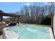 Relaxing hot tub with pergola and outdoor seating area provides a backyard entertainment space at 2352 Seagull Dr, Denver, NC 28037