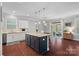 Bright kitchen featuring a large island, granite counters, stainless appliances, and a connected breakfast nook at 2352 Seagull Dr, Denver, NC 28037