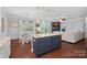 Open-concept kitchen with a center island, pendant lights, and seamless flow to the breakfast and living areas at 2352 Seagull Dr, Denver, NC 28037