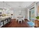 Bright eat-in kitchen featuring a granite island with bar seating and sliding doors to the backyard at 2352 Seagull Dr, Denver, NC 28037