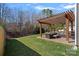 Backyard patio area features a pergola, outdoor seating, and a lush green lawn at 2352 Seagull Dr, Denver, NC 28037