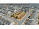 Aerial view showcasing a residential neighborhood with a central park, offering green space for recreation at 2463 Diplomat Ln, Charlotte, NC 28210