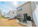Spacious backyard featuring a patio, lawn area, and sliding glass doors for seamless indoor-outdoor living at 2463 Diplomat Ln, Charlotte, NC 28210