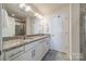 Bright bathroom with double vanity, granite counters, and walk-in shower at 2463 Diplomat Ln, Charlotte, NC 28210