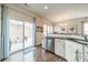 Kitchen with stainless steel dishwasher and sink plus access to an outdoor patio, dining room, and living area at 2463 Diplomat Ln, Charlotte, NC 28210