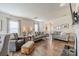 Spacious living room with hardwood floors, large windows, and comfortable seating arrangement at 2463 Diplomat Ln, Charlotte, NC 28210