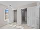 Bright bedroom featuring a closet with plenty of space, and a large window for natural light at 3203 Arklow Rd, Charlotte, NC 28269