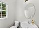 Bathroom featuring a pedestal sink, modern fixtures, and a window at 329 Squirrel Ln, Clover, SC 29710