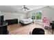 Bright bedroom with hardwood floors, ceiling fan, and natural light from the double window at 329 Squirrel Ln, Clover, SC 29710