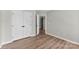 This bright bedroom features hardwood floors, neutral walls, and large closet at 329 Squirrel Ln, Clover, SC 29710