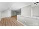 Spacious bonus room with hardwood floors and neutral paint tones throughout at 329 Squirrel Ln, Clover, SC 29710
