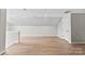 Hardwood floors in this bright bonus room provide a clean and inviting space at 329 Squirrel Ln, Clover, SC 29710